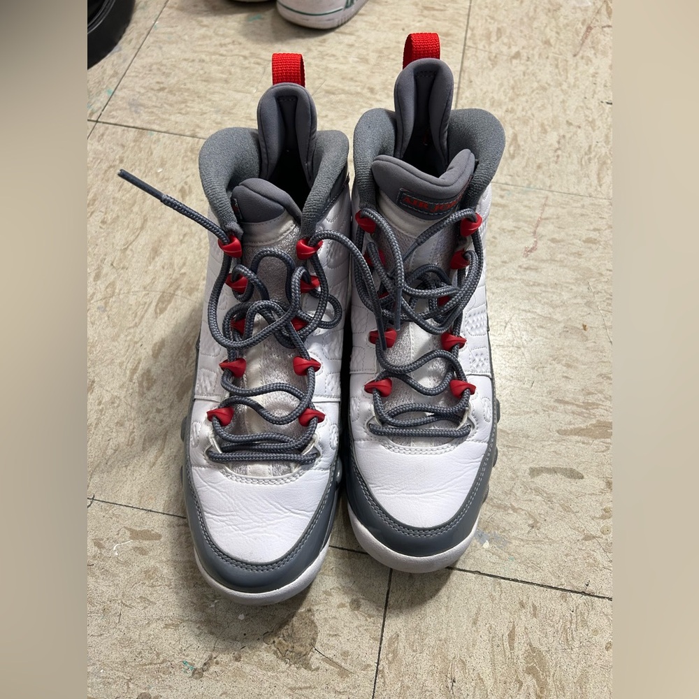 Red, white and gray Jordan shoes